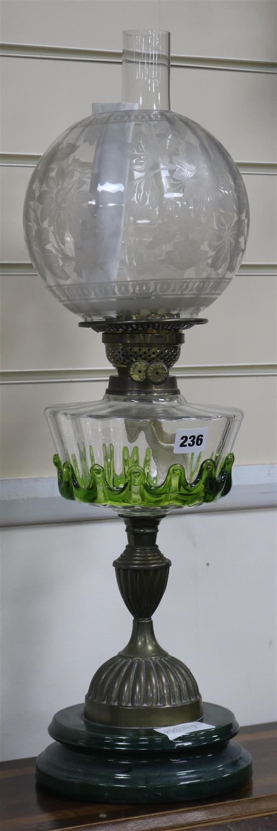 A Victorian glass and brass oil lamp